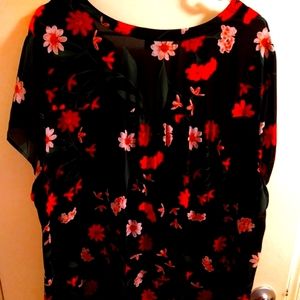 A black floral Georgette split neck short sleeve blouse.